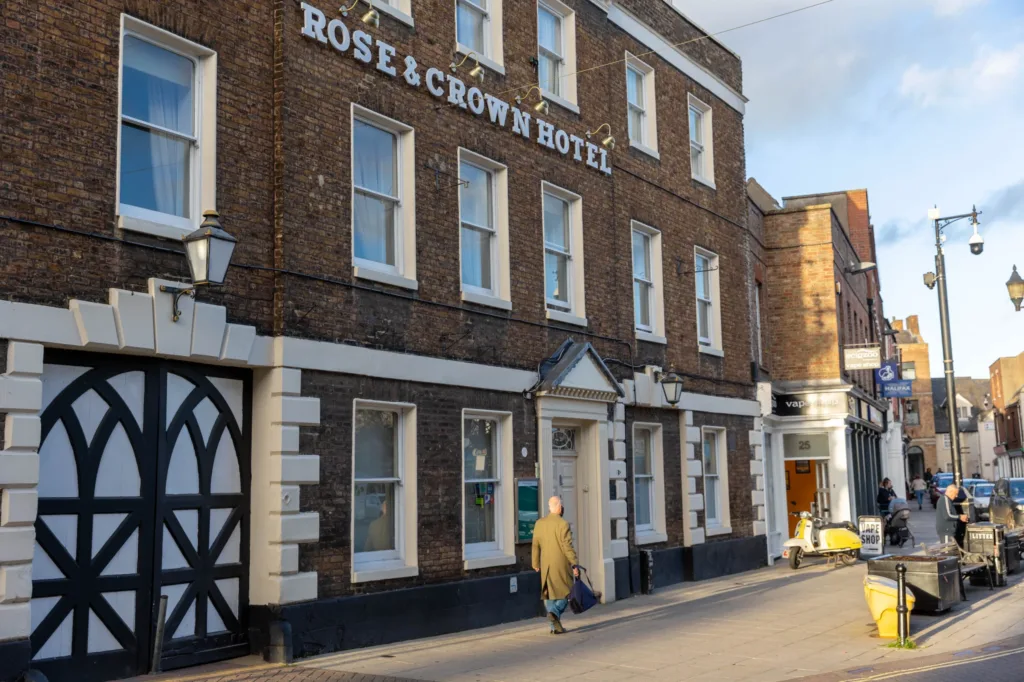 Windows open and lights on as people come and go at the Closed Rose and Crown Hotel. - News for Peterborough and Cambridgeshire News for Peterborough and Cambridgeshire -