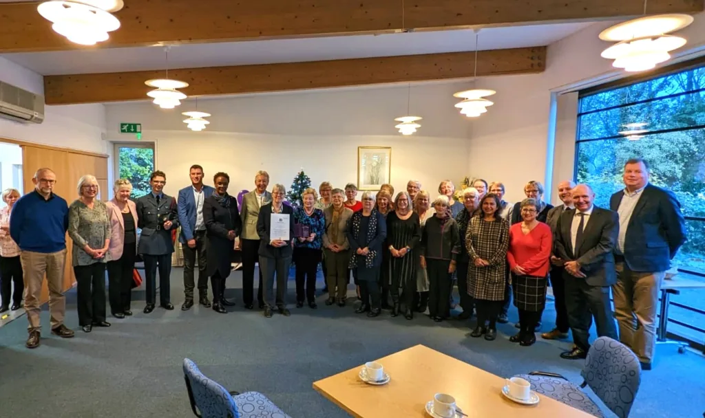Library volunteers raise the roof to celebrate Queen’s Award honour