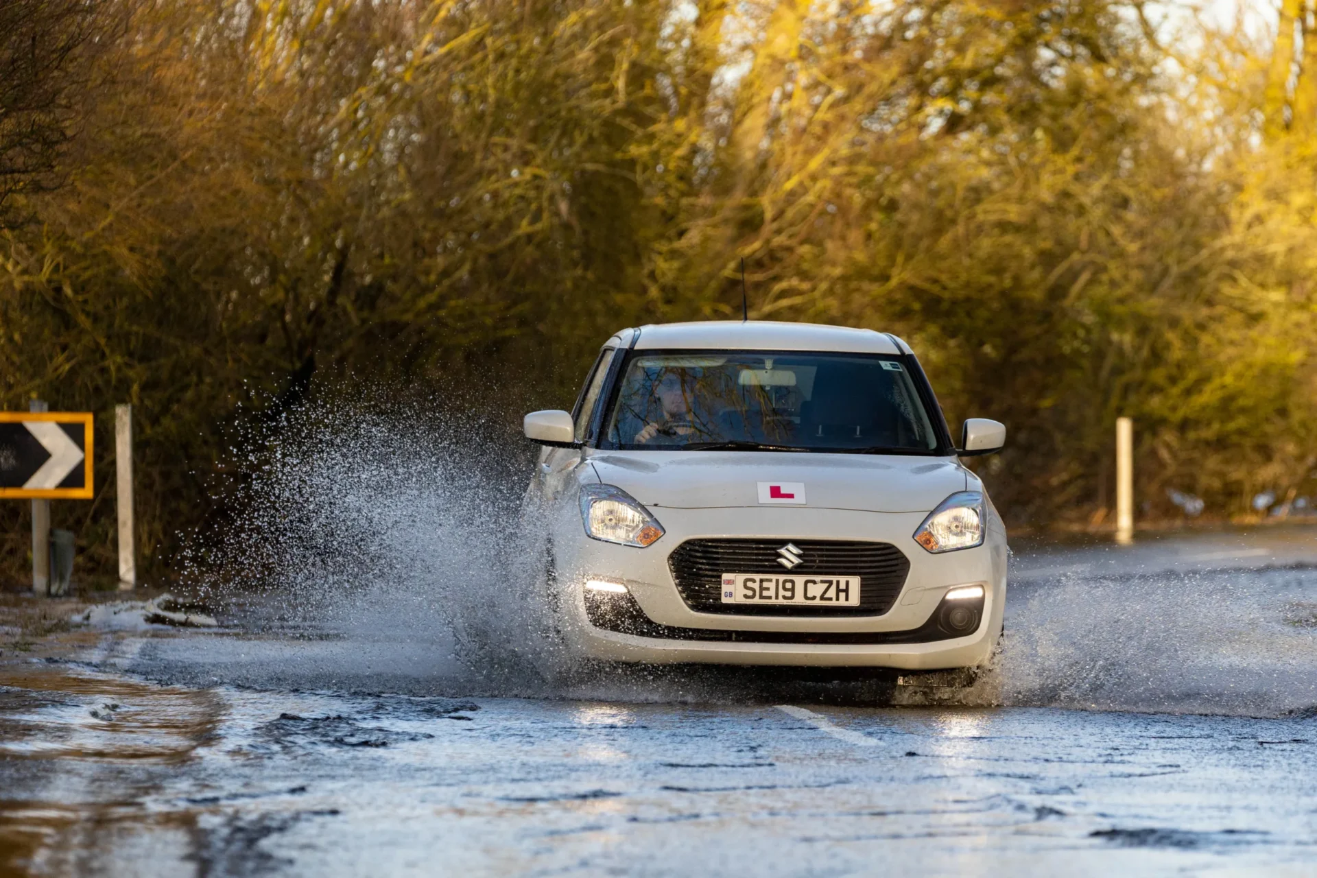 Flooded Cambridgeshire/Norfolk road fails to deter a hardy handful