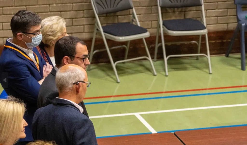 Cllr Ryan Fuller (glasses) watching the counting at St Ives leisure centre. He lost his seat on Huntingdonshire District Council. PHOTO: Terry Harris