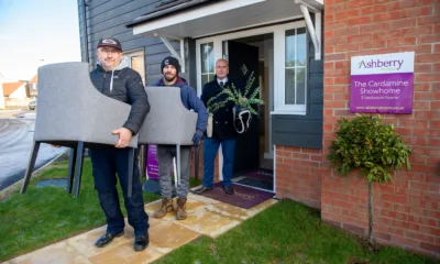 Darren Holloway and David Kelly from Emmaus Cambridge with sales advisor Stuart Burton from Ashberry Homes, outside the showhome at Cortlands in Fordham, with some of the furniture donated to the charity.
