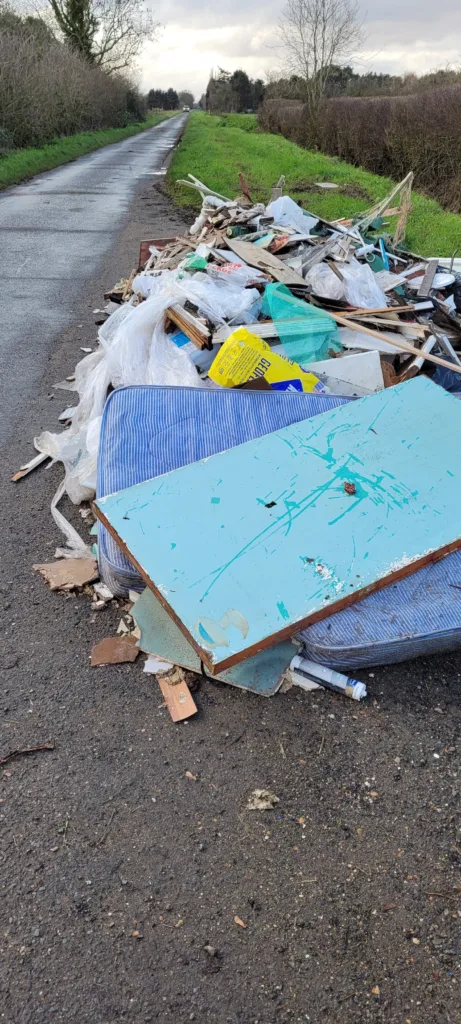 The dumped rubbish in Long Drove, Cottenham, consisted of timber, mattresses, carpets, tiles, and other household waste, and was removed from a property in Huntingdon as part of renovation works.