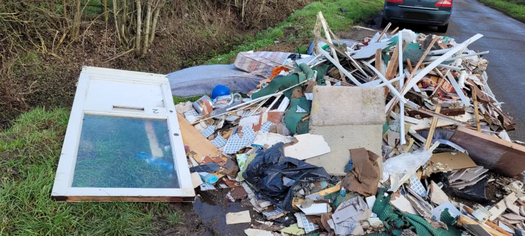 The dumped rubbish in Long Drove, Cottenham, consisted of timber, mattresses, carpets, tiles, and other household waste, and was removed from a property in Huntingdon as part of renovation works.