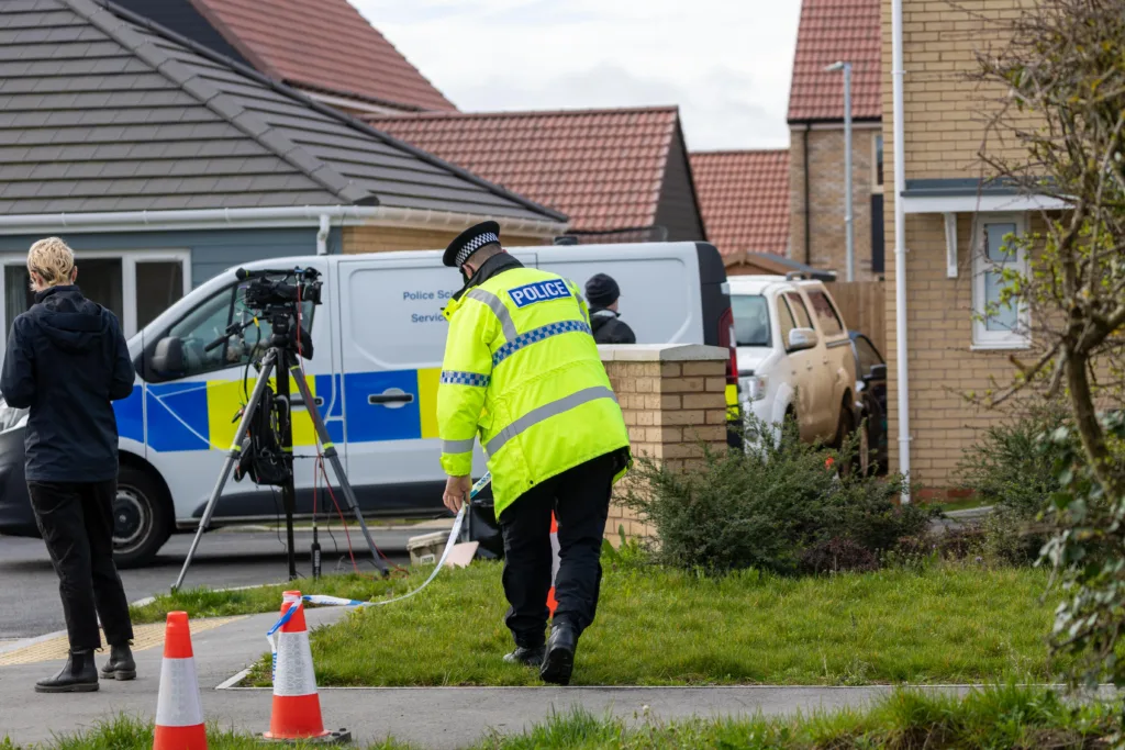 Scene of one of two murders in Cambridgeshire last night: police at a house in Meridian Close, Bluntisham, where the body of one of the victims was found at just after 9pm following reports reports of gunshots.