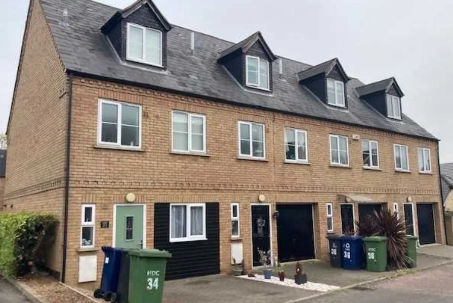 An Englishman’s home is his castle – and in this case, at St Neots, his garage is too. So, he can use it as a bedroom (end terrace)