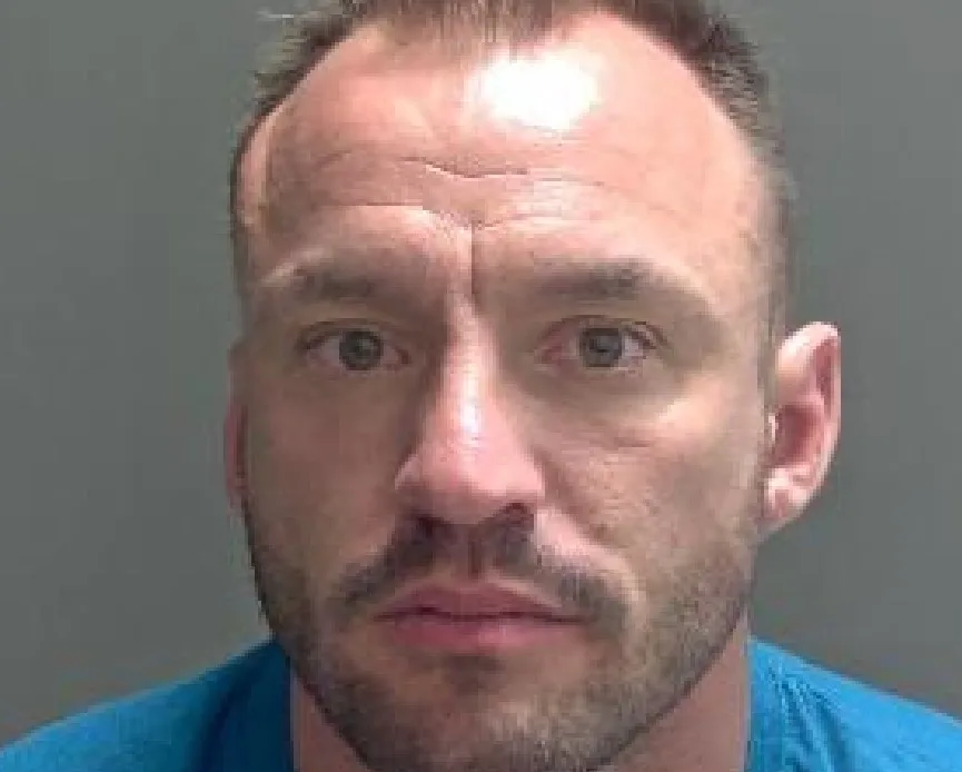 Daniel Holyoak, 39, punched the victim numerous times, stamped all over her body, dragged her around by her hair and repeatedly slammed a door into her