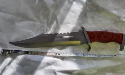 “During the search for the male, a large hunting 'RAMBO' style knife was located.