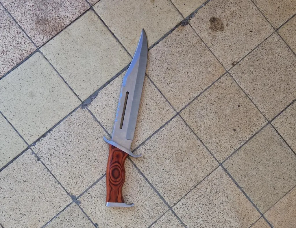 “During the search for the male, a large hunting 'RAMBO' style knife was located.