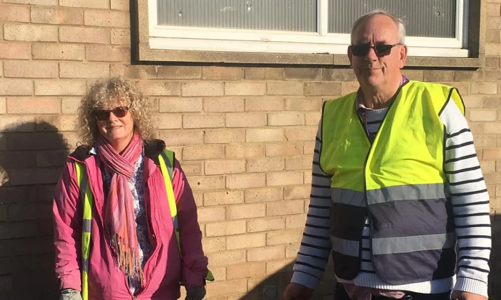 Cllr Dave Patrick with Ruth Freeman outside Walsoken Village Hall last year where they had undertaken a litter pick.