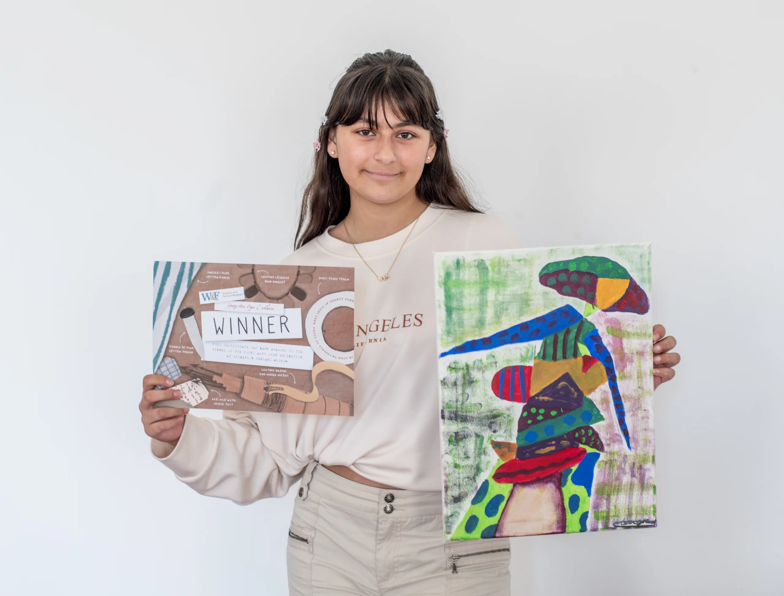 Mia Grewal with her winning painting Lady in a Hat. Mia Grewal with her winning painting Lady in a Hat.