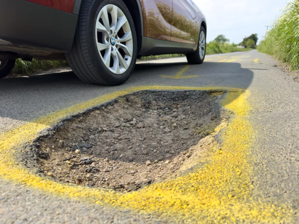 The artistic touch to draw attention to the pothole has appeared at Murrow near Wisbech and could be there for a while. PHOTO: Terry Harris for CambsNews