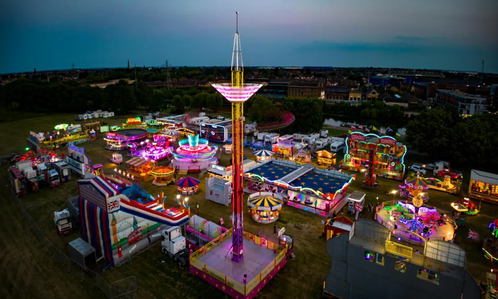 The fun fair arrives in Peterborough. Both aerial and ground level shots of different rides., City Centre, Peterborough Thursday 15 June 2023. Picture by Terry Harris.
