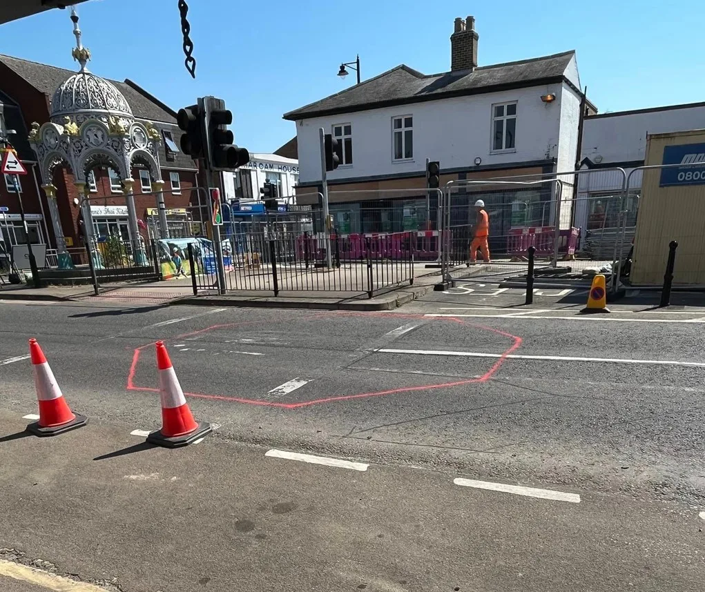 Official photo by Fenland Council (left) showing new position of March Fountain. On the right is the photo produced by Malletts jewellers which they claim shows the true horror of relocating it outside their shop.