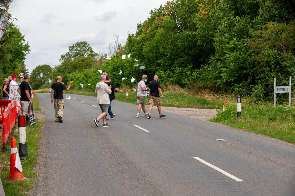 Babestation Zoe Grey and Stella Paris turn up to raise awareness of animal testing at MBR Acres, Bailiffs on behalf of Mills and Reeves throw papers at people in an attempt to serve them but just litter the highway. MBR Acres, Huntingdon Monday 10 July 2023. PHOTO: Terry Harris 