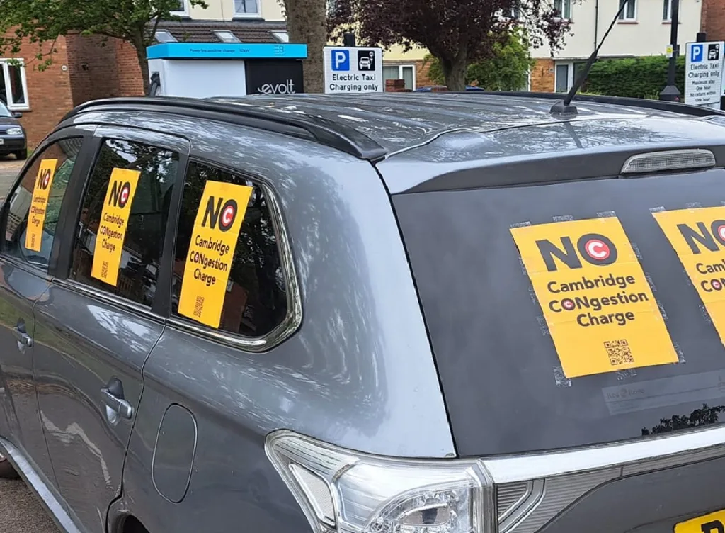Taxi driver Delowar Hossain (inset) won historic by election opposed to Cambridge congestion charge