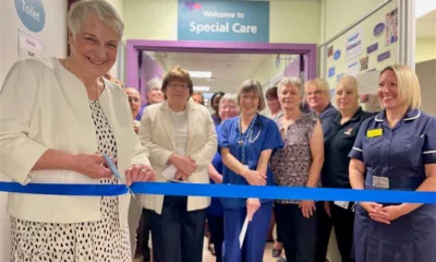 Anne-Marie Hamilton, previous Dreamdrops charity chair, cutting the blue ribbon during the official open with SCBU staff and charity representatives.
