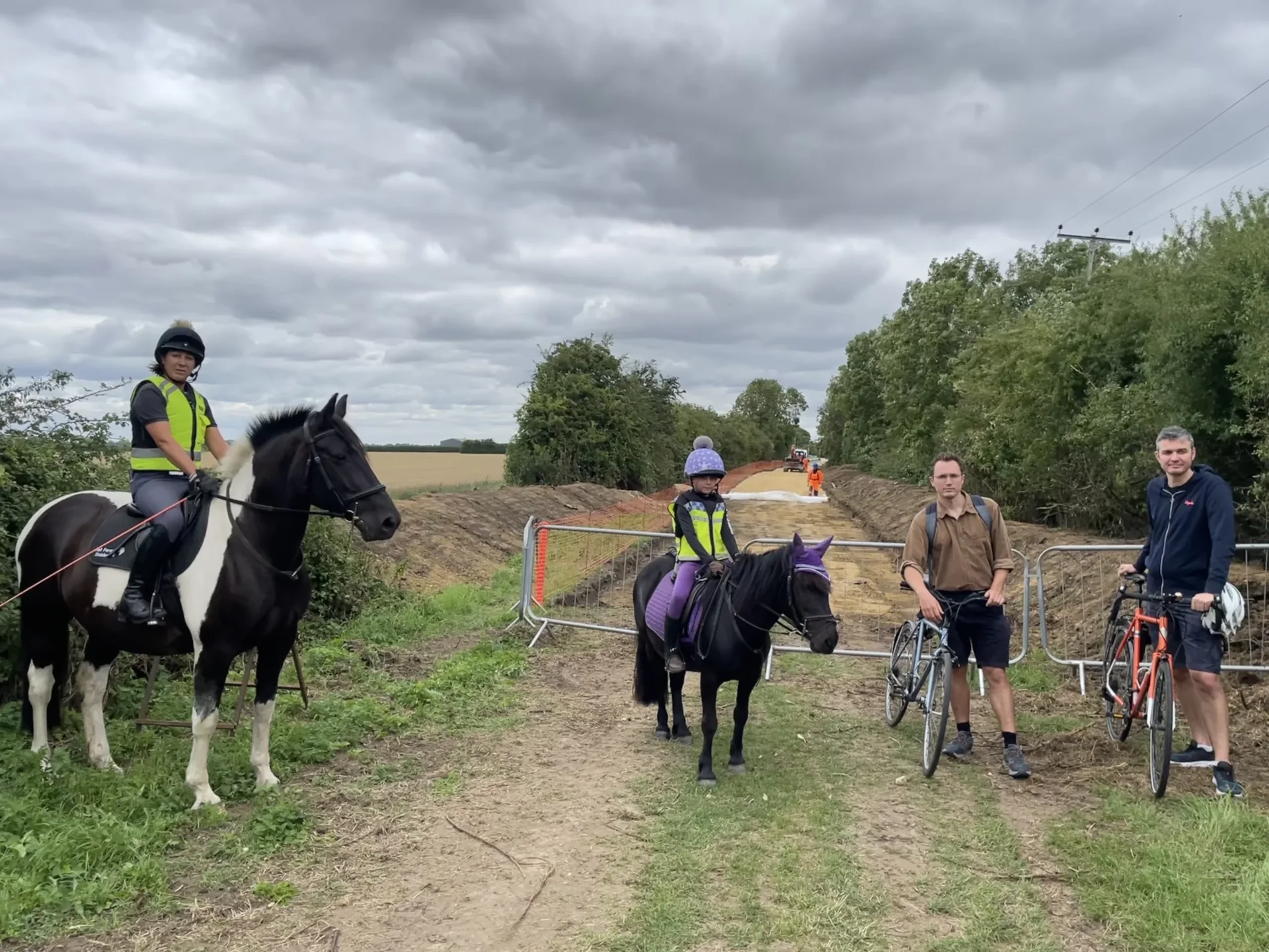 NorthofButtLane (002) - News for Peterborough and Cambridgeshire News for Peterborough and Cambridgeshire - The photos show the works north of Butt Lane and the narrower section south of Butt Lane where trees are already being cleared. Those featured are Tessa Frost of Hall Farm Stables in Waterbeach on Bea and Violet Frost on Moppet. Josh Grantham (brown shirt) is the Infrastructure Campaigner for Camcycle and Gabriel Bienzobas (pictured in the north photo) is a Camcycle trustee and lead of Milton Cycling Campaign.