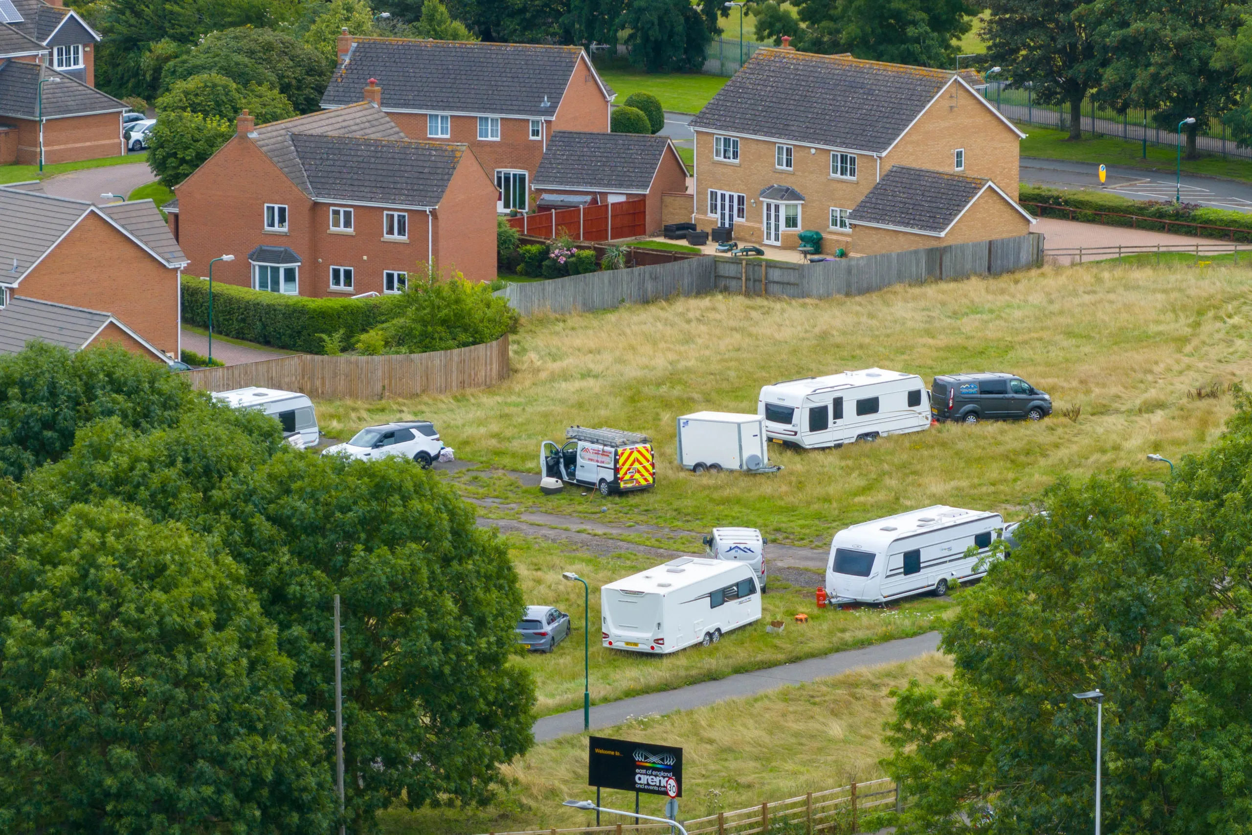 The caravans that have forced their way onto land which is part of the Peterborough showground. The caravans that have forced their way onto land which is part of the Peterborough showground.
