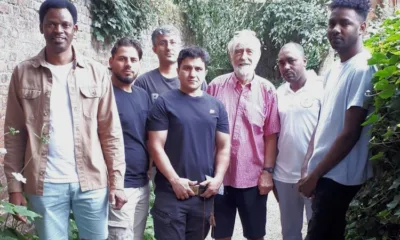 Pictured above is Sean Finlay with his Wisbech guests at Peckover House. Mr Finlay and his friends took a party of asylum seekers currently being housed at Rose and Crown Hotel out for a visit to the National Trust property.