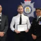 Pc Dane is pictured with Chief Superintendents Jon Hutchinson and Becky Tipping