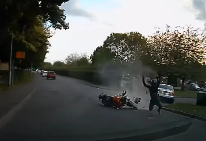 Stavius Gordon flipped off his motor bike as it burst into flames causing damage to the Audi and a nearby private ambulance. 