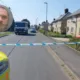 Convicted paedophile Paul Page (inset) and the police cordon in May in Parson’s Lane, Littleport.