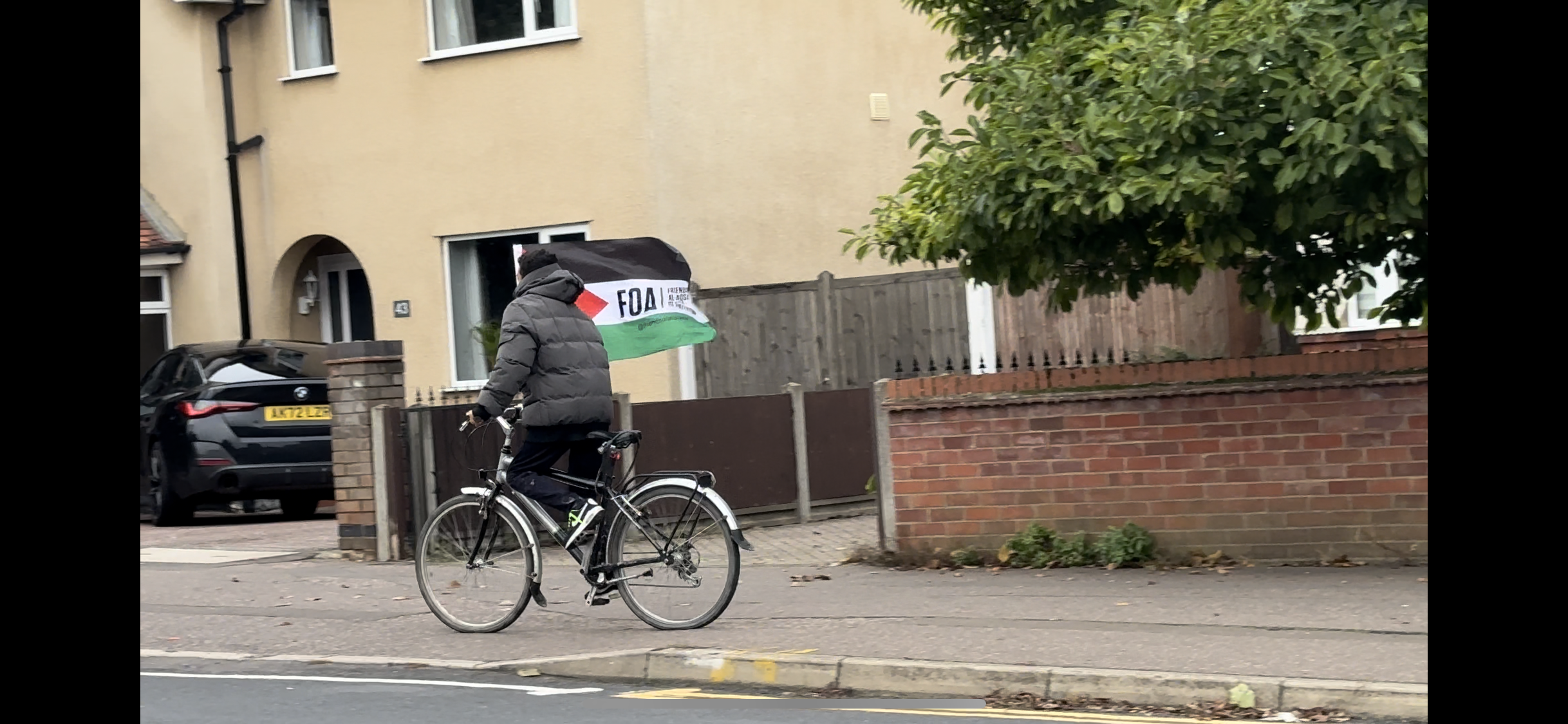 The cyclist was spotted in Stanground riding up and down the streets with a Friends of Al-Aqsa (FOA) flag held high. The cyclist was spotted in Stanground riding up and down the streets with a Friends of Al-Aqsa (FOA) flag held high.