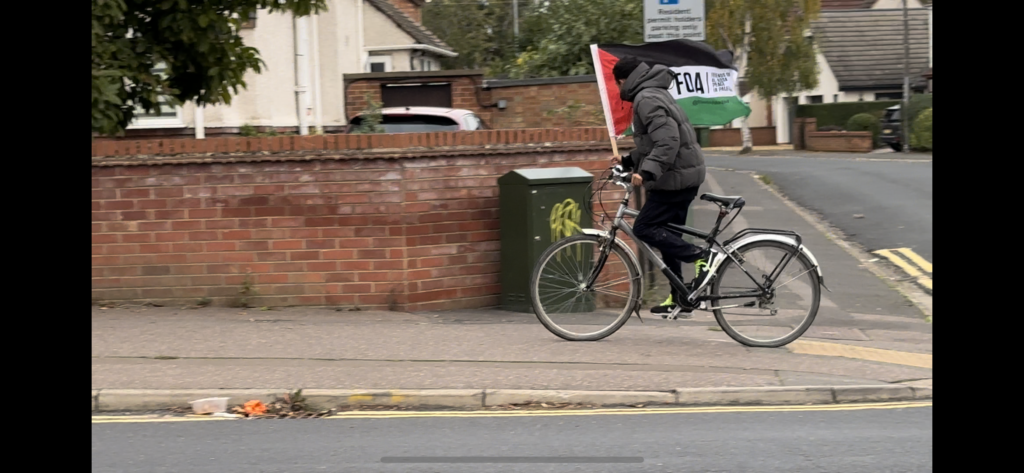 IMG_2229 - News for Peterborough and Cambridgeshire The cyclist was spotted in Stanground riding up and down the streets with a Friends of Al-Aqsa (FOA) flag held high.