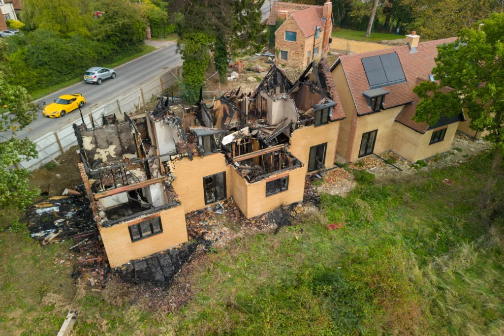 Man arrested following arson attack that destroyed two newly built homes at St Ives