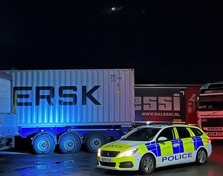 Four men have been charged following break-ins of 20 lorries at Cambridge services off the A14