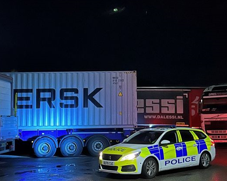 Four men have been charged following break-ins of 20 lorries at Cambridge services off the A14