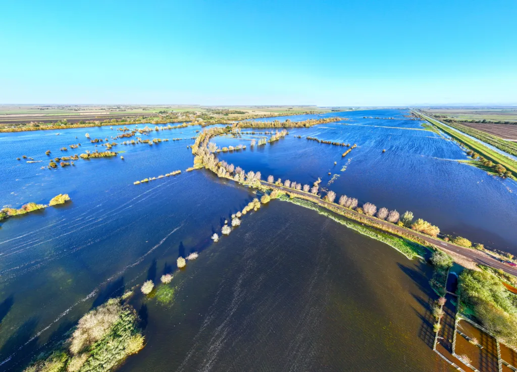 Residents of Welney are angry that full barriers are not being put across flooded Welney Wash Road. In Whittlesey, where roads are also flooded, full barriers prevent access. PHOTO: Bav Media