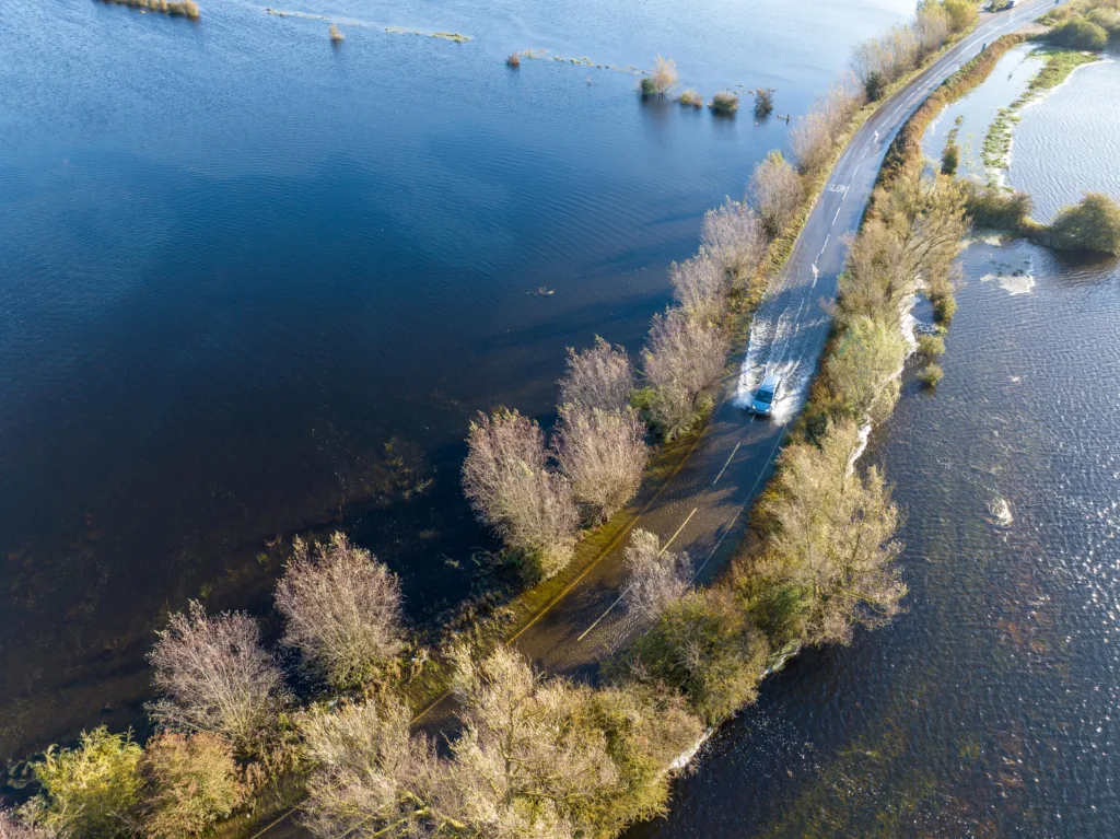 A1101 at Welney where many have chosen to find alternative routes today as water levels rise and most motorists have avoided, including those who attempted to cross but changed their mind. Bigger vehicles are still going through. PHOTO: Terry Harris for CambsNews 