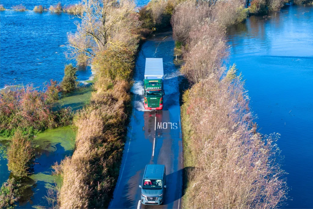 A1101 at Welney where many have chosen to find alternative routes today as water levels rise and most motorists have avoided, including those who attempted to cross but changed their mind. Bigger vehicles are still going through. PHOTO: Terry Harris for CambsNews 