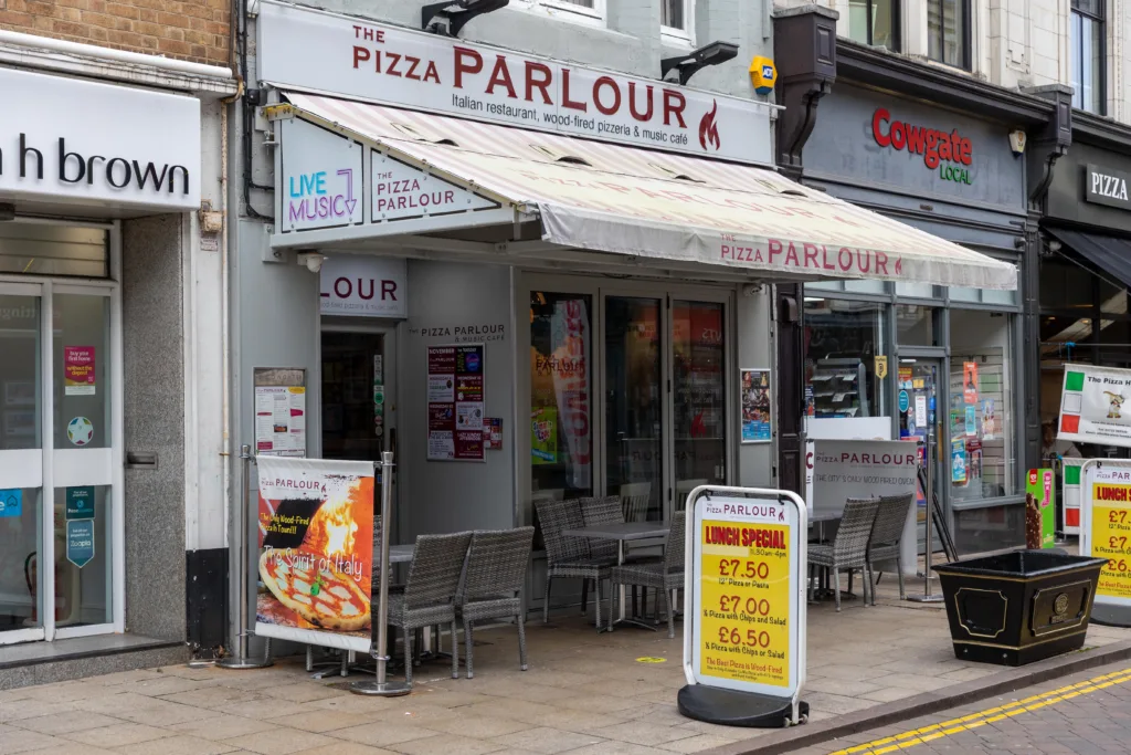 Pizza Parlour. - News for Peterborough and Cambridgeshire 572 people signed a petition to the city council saying that “e the customers of the Pizza Parlour and Music Café submit this petition to support for the construction of the new fixed canopy outside of the restaurant to allow customers to enjoy outside dining”. But the fixed canopy has lost its final battle with planners. PHOTO: Terry Harris