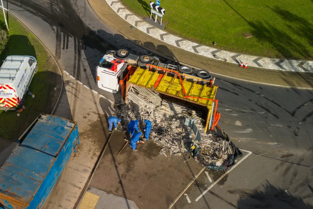 The scene at Witchford roundabout today as recovery takes place of the contents of a lorry that shed its load. PHOTO: Terry Harris for CambsNews
