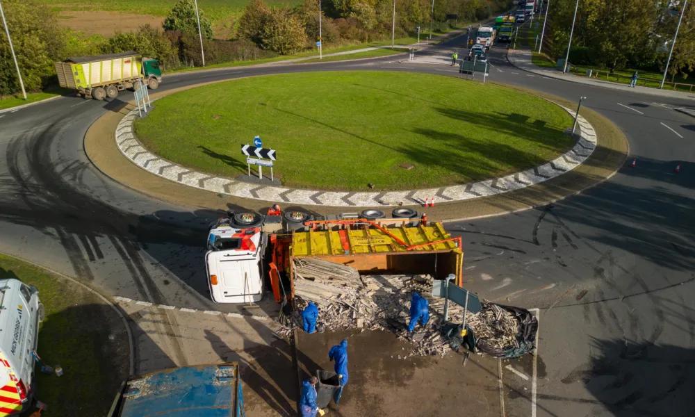 The scene at Witchford roundabout today as recovery takes place of the contents of a lorry that shed its load. PHOTO: Terry Harris for CambsNews