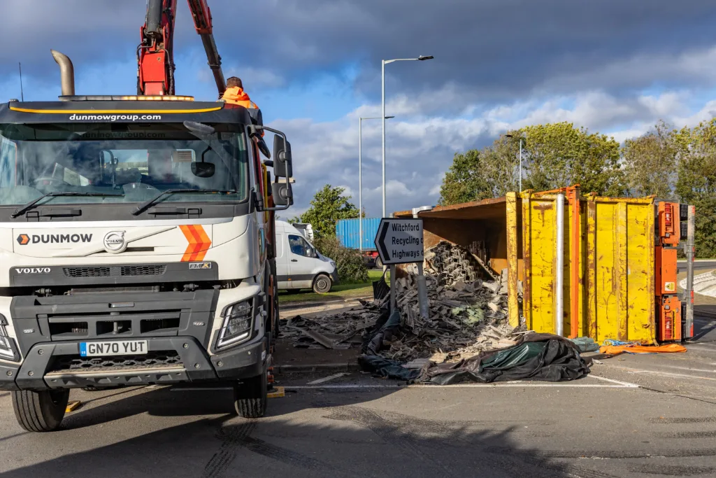 The scene at Witchford roundabout today as recovery takes place of the contents of a lorry that shed its load. PHOTO: Terry Harris for CambsNews
