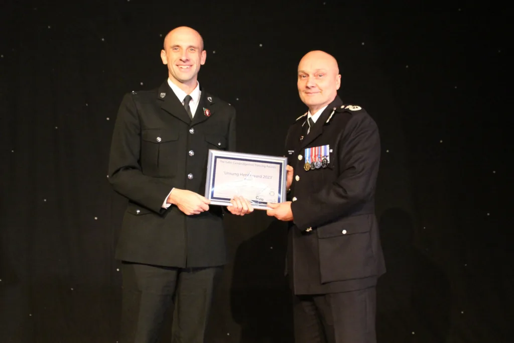 PC Justin Bielawski receives one of his two awards from chief constable Nick Dean 