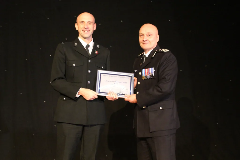 PC Justin Bielawski receives one of his two awards from chief constable Nick Dean