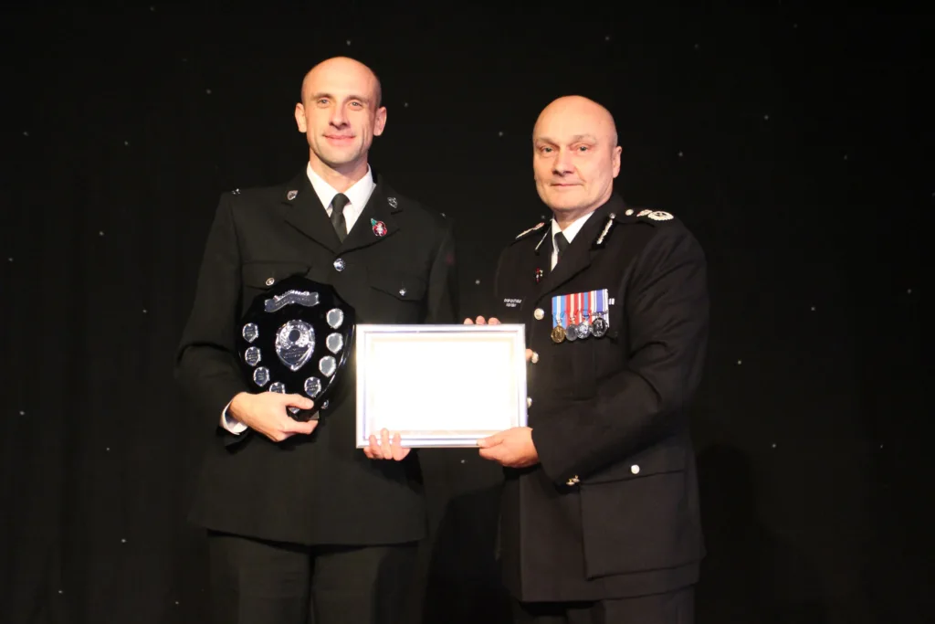 PC Justin Bielawski receives one of his two awards from chief constable Nick Dean 