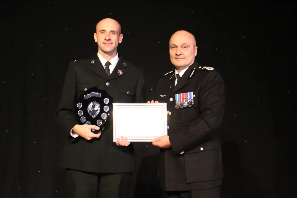PC Justin Bielawski receives one of his two awards from chief constable Nick Dean