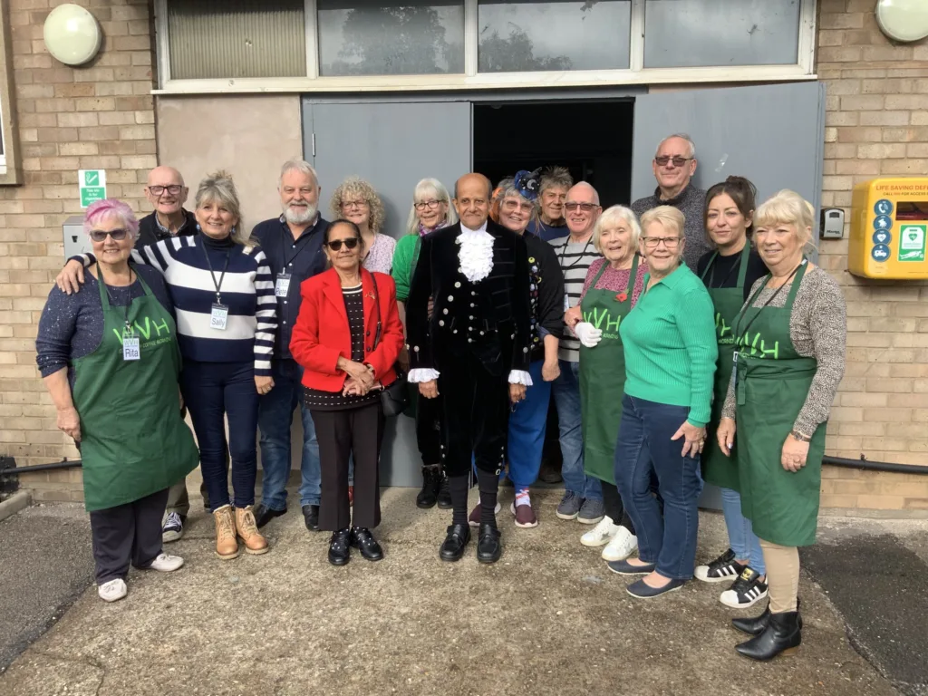 High Sheriff of Cambridgeshire, Dr Bharatkumar Khetani, cut the birthday cake as Walsoken Village Hall Community Coffee Morning celebrated its 2nd anniversary. Local police dropped in for a cuppa and cake. PHOTO: Wisbech Tweet 
