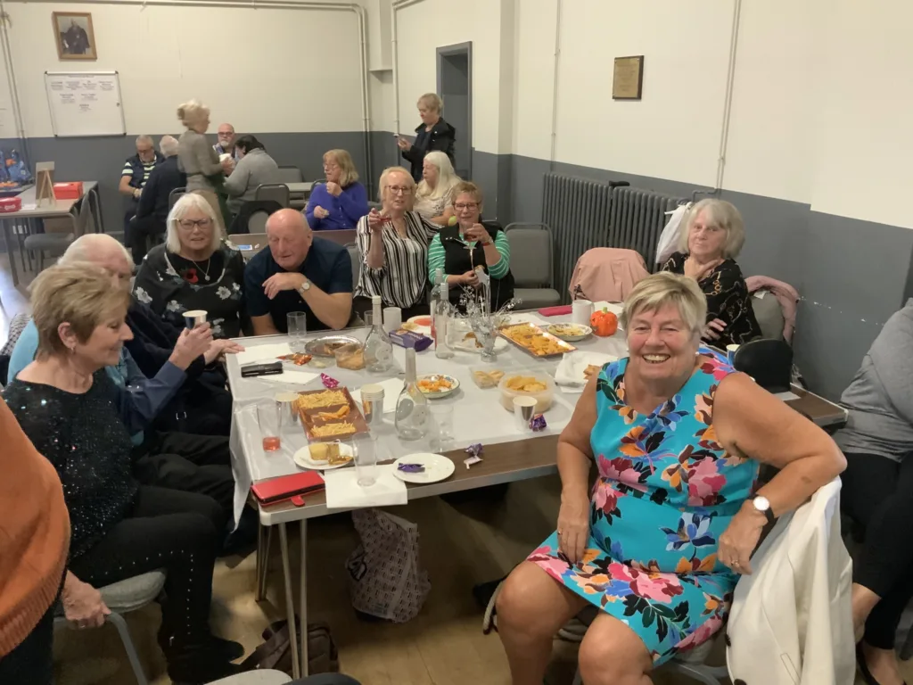 High Sheriff of Cambridgeshire, Dr Bharatkumar Khetani, cut the birthday cake as Walsoken Village Hall Community Coffee Morning celebrated its 2nd anniversary. Local police dropped in for a cuppa and cake. PHOTO: Wisbech Tweet 
