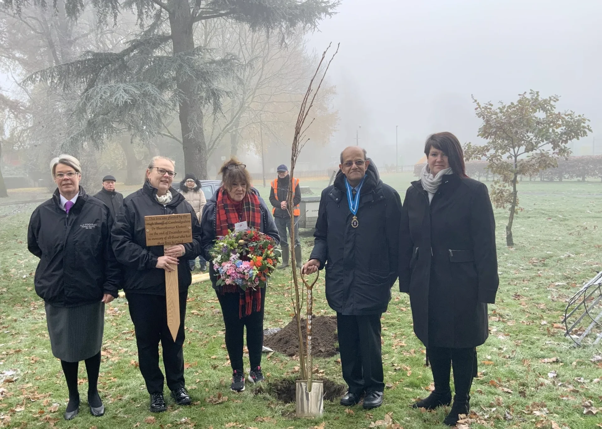 COVID 12 - News for Peterborough and Cambridgeshire News for Peterborough and Cambridgeshire - The High Sheriff of Cambridgeshire Dr Bharatkumar N Khetani plants a tree and unveils a plaque in memory of Covid victims was planted in Wisbech. PHOTO: Wisbech Tweet