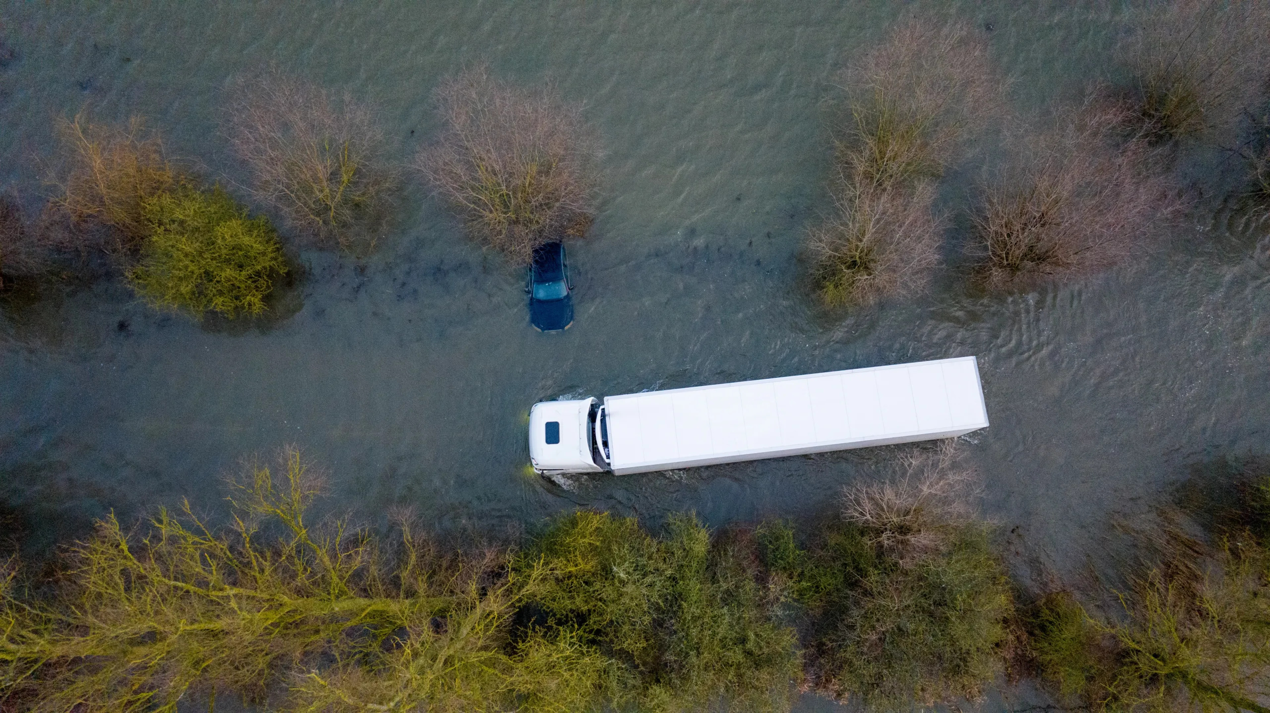 Abandoned car on the flooded A1101 in Welney, Norfolk, on Wednesday morning as the flooding continues after the recent heavy rain. PHOTO: BavMedia 