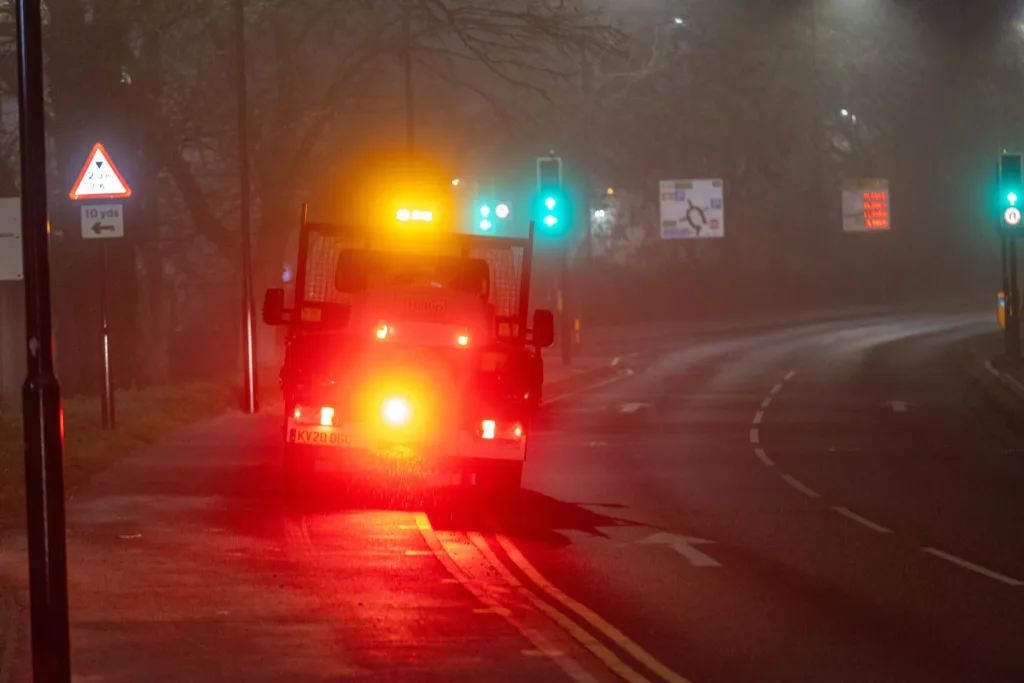 Gritter spotted driving from near TK Maxx to Railway Station Car Park along the path while gritting in the fog and dark.,Bourges Boulevard , Peterborough Saturday 02 December 2023. 