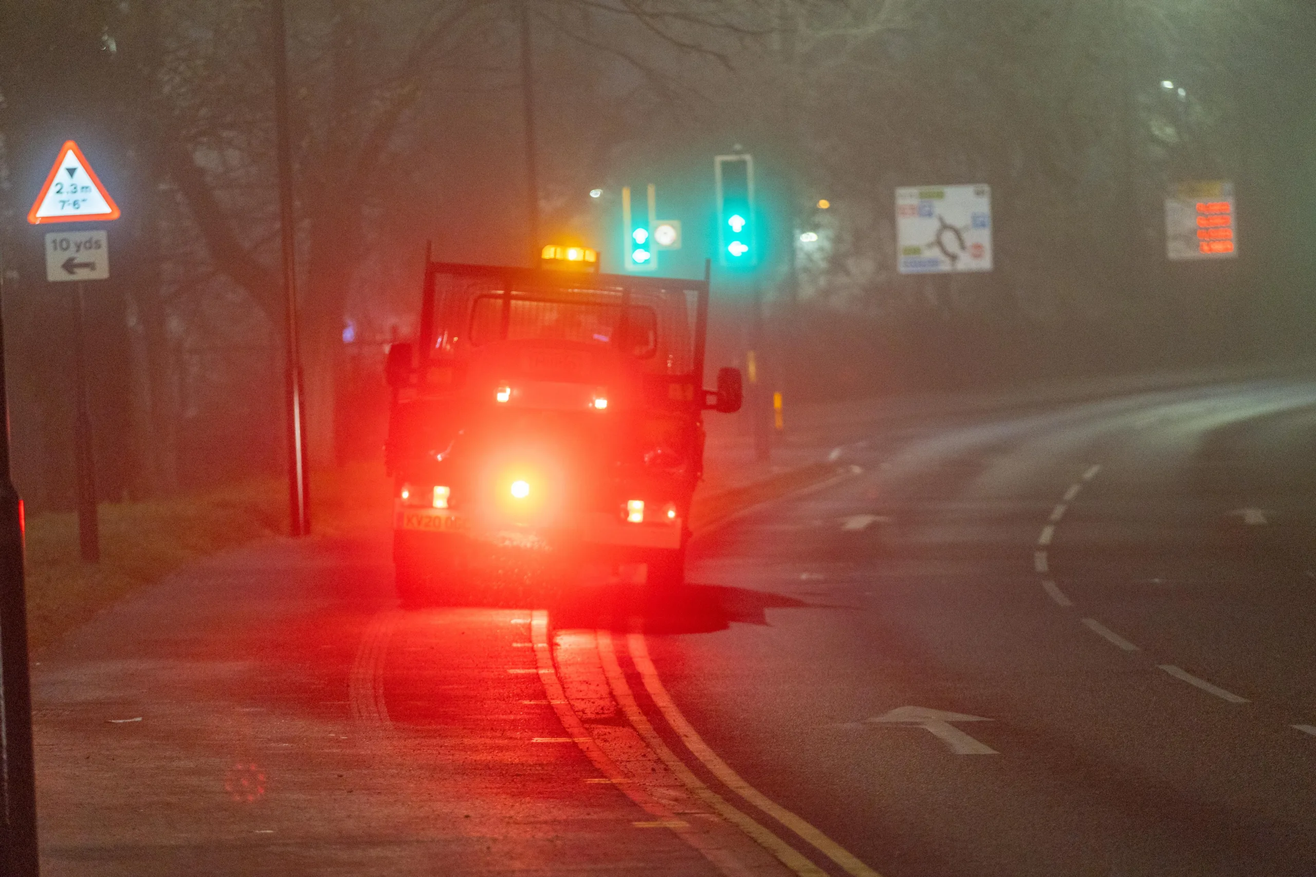 Gritter spotted driving from near TK Maxx to Railway Station Car Park along the path while gritting in the fog and dark., Bourges Boulevard , Peterborough Saturday 02 December 2023.