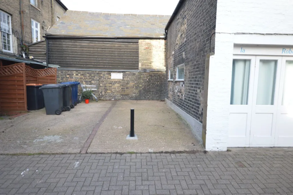 The parking space at the end of Victoria Street measures 6.07m x 2.64m and is bordered on 2 sides by residential property and to its left-hand side by a separately owned parking space.
