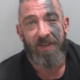 Dannie McGavigan, 43, repeatedly punched his partner in the face and dragged her through the house